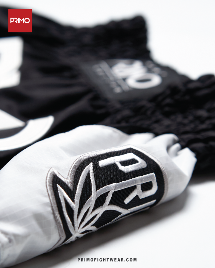 Muay Thai Shorts - Free Flow Series - Off Wai - Primo Close up tag